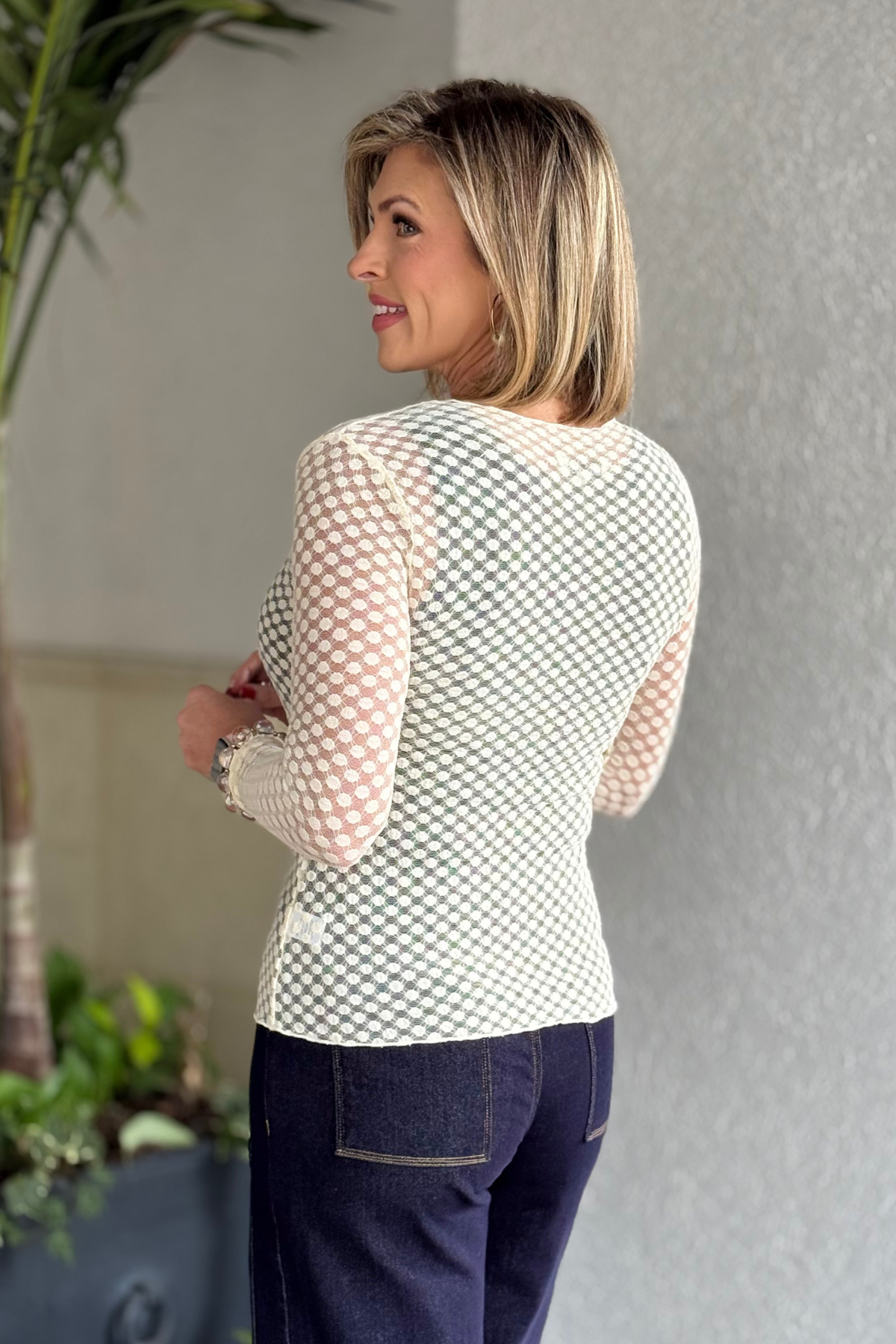 Long sleeve textured mesh layering top on model