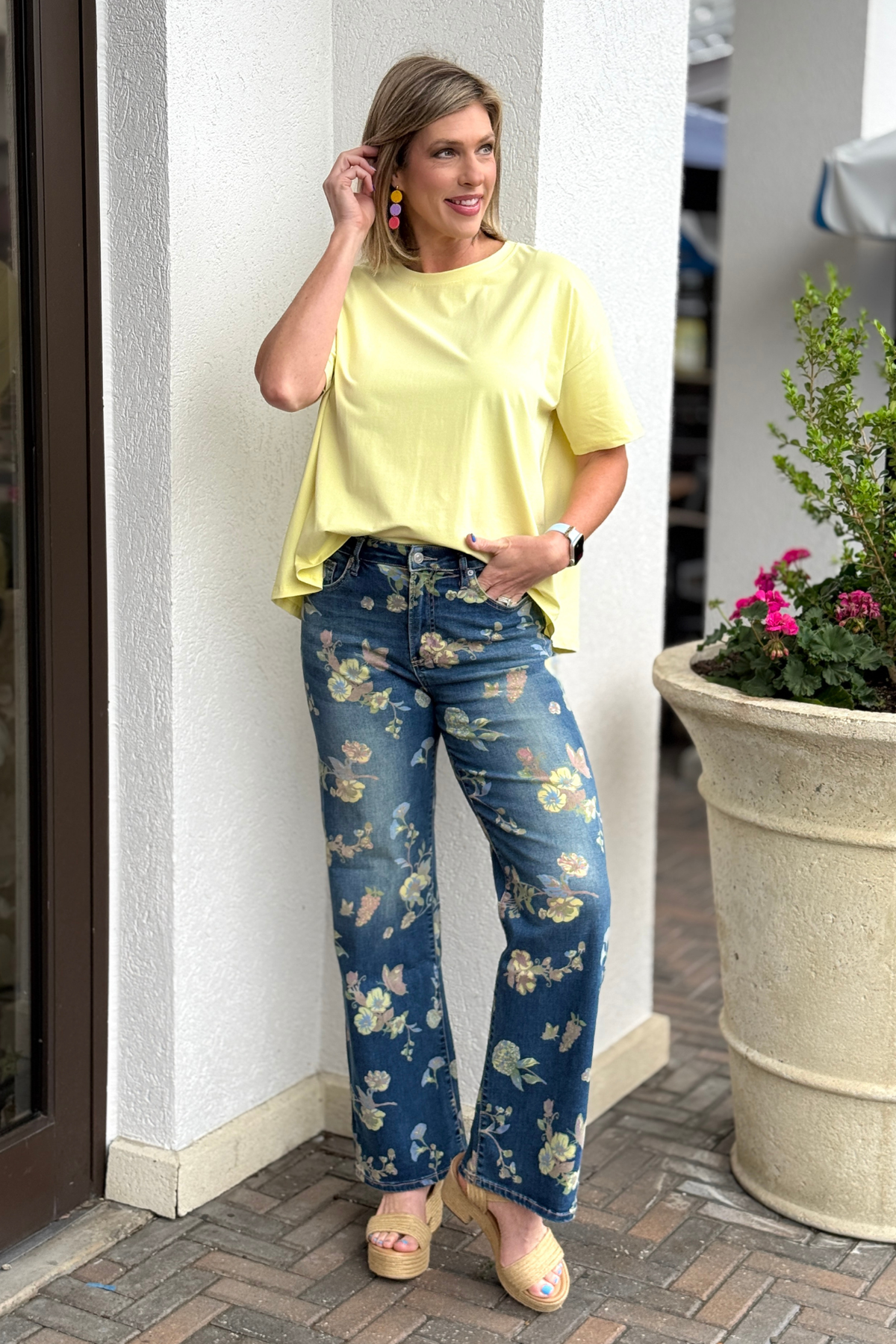 High rise floral wide leg jeans styled with yellow top and wedges