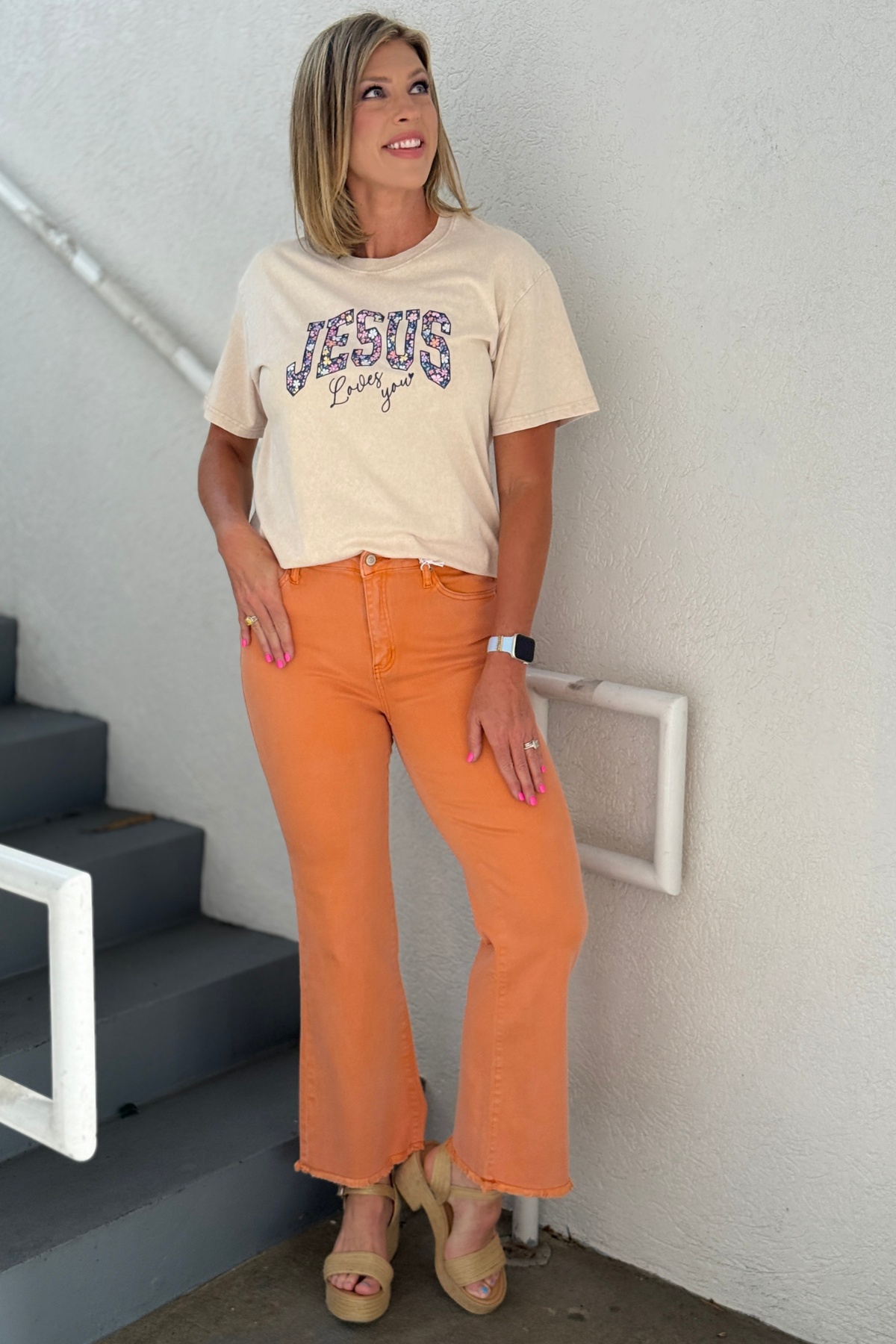 Woman wearing orange wide leg boutique jeans