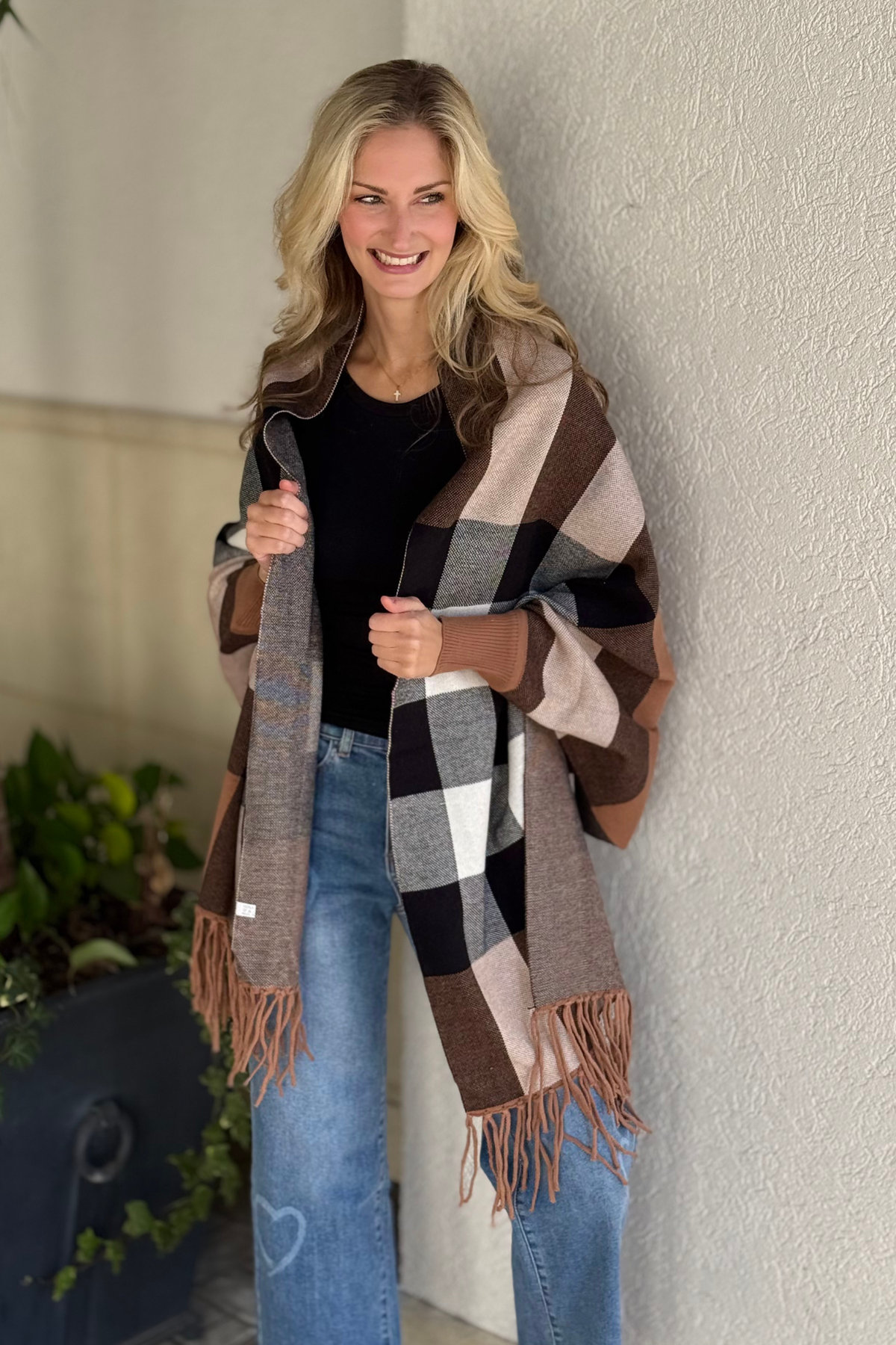 Cozy beige fall poncho layered over black top