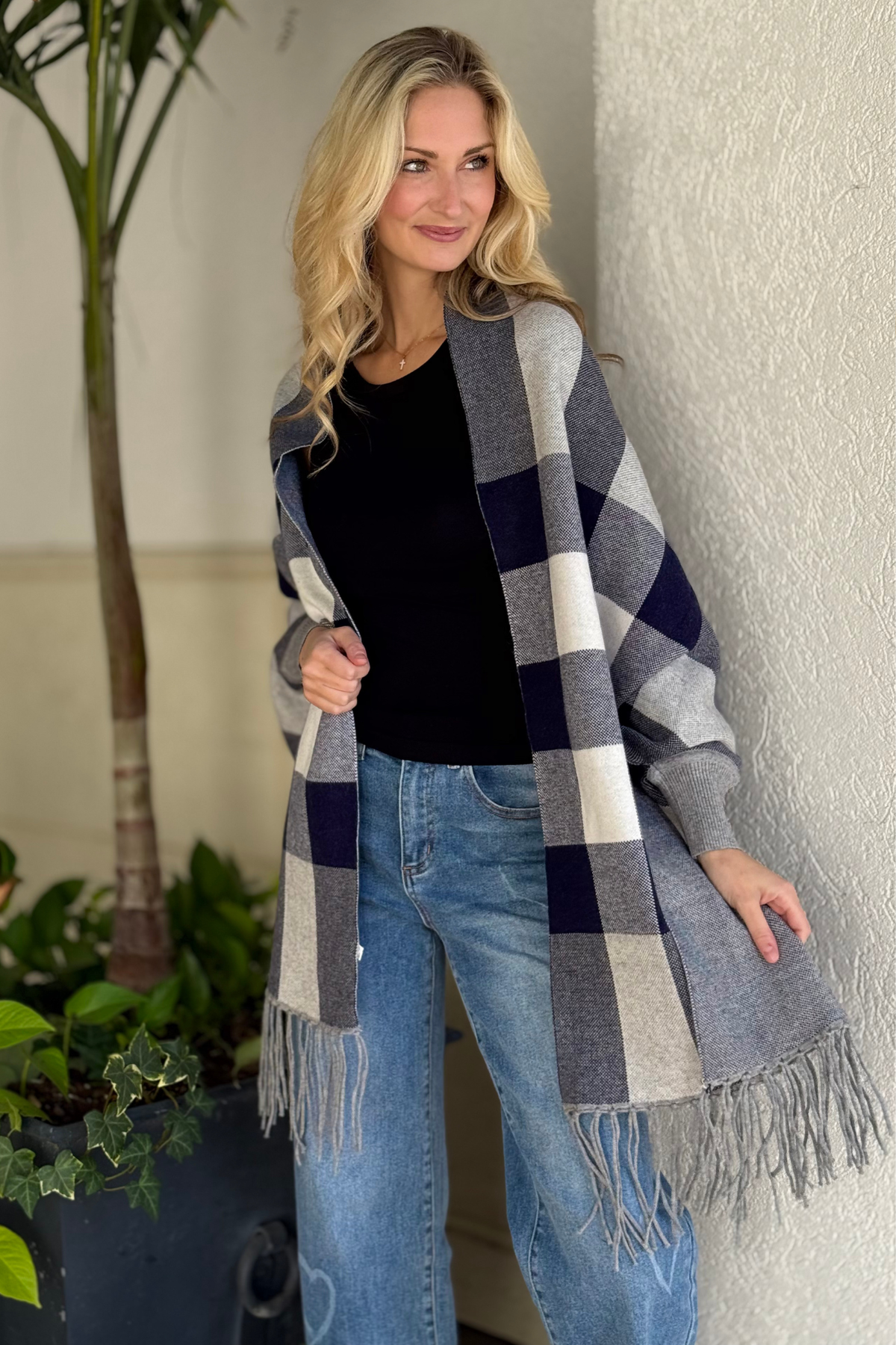 Cozy navy shawl layered over black top