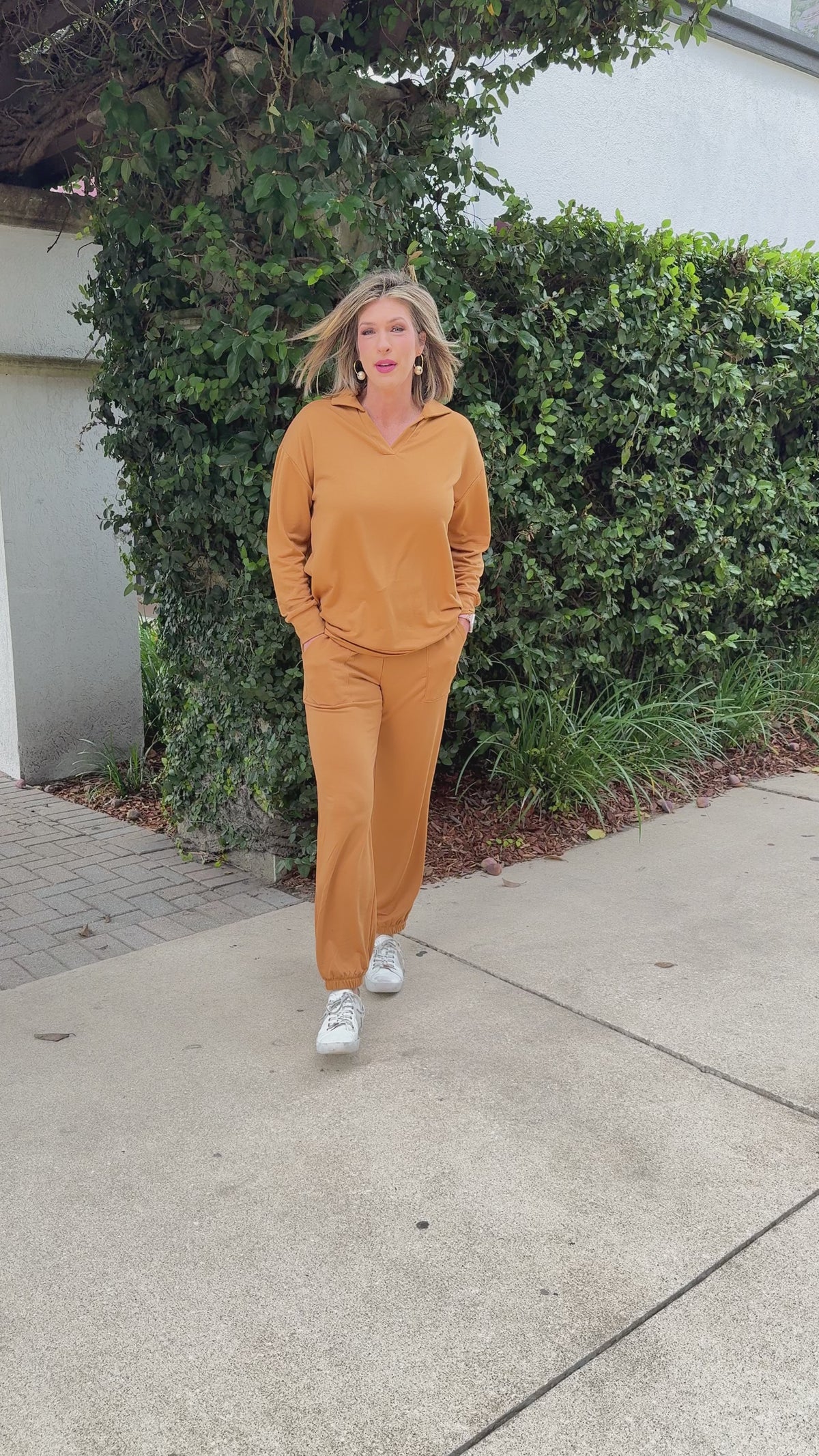 Model in marigold two-piece lounge set with elastic waist joggers