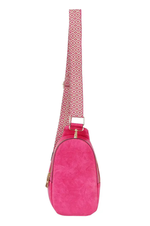 Hot pink vegan leather sling bag with patterned guitar strap