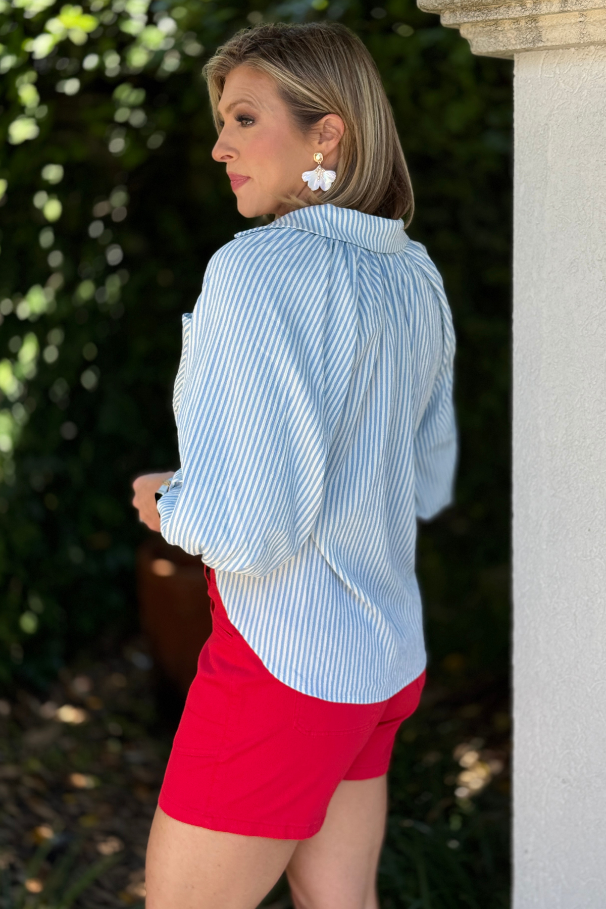 blue stripe blouse with wavy hem detail