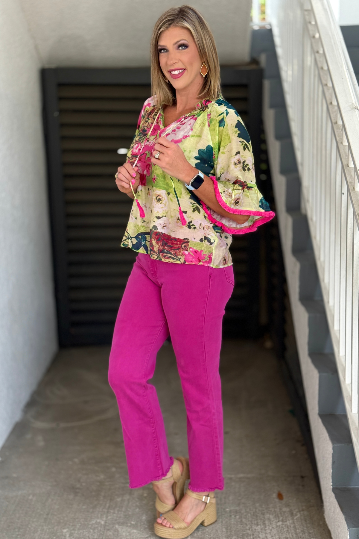 Relaxed fit boutique blouse with ruffle trim and tassel neckline