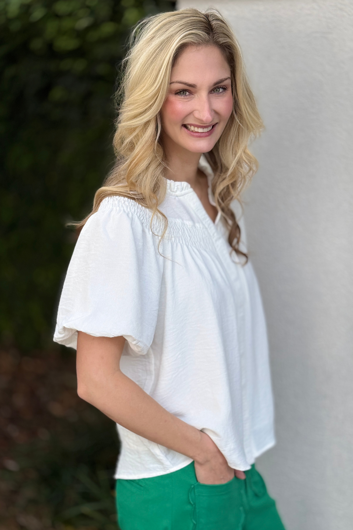 Women’s white button down blouse with covered placket