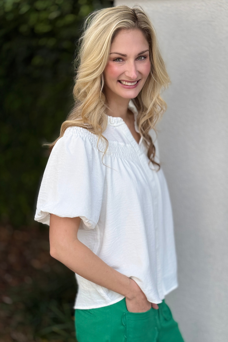 Women’s white button down blouse with covered placket