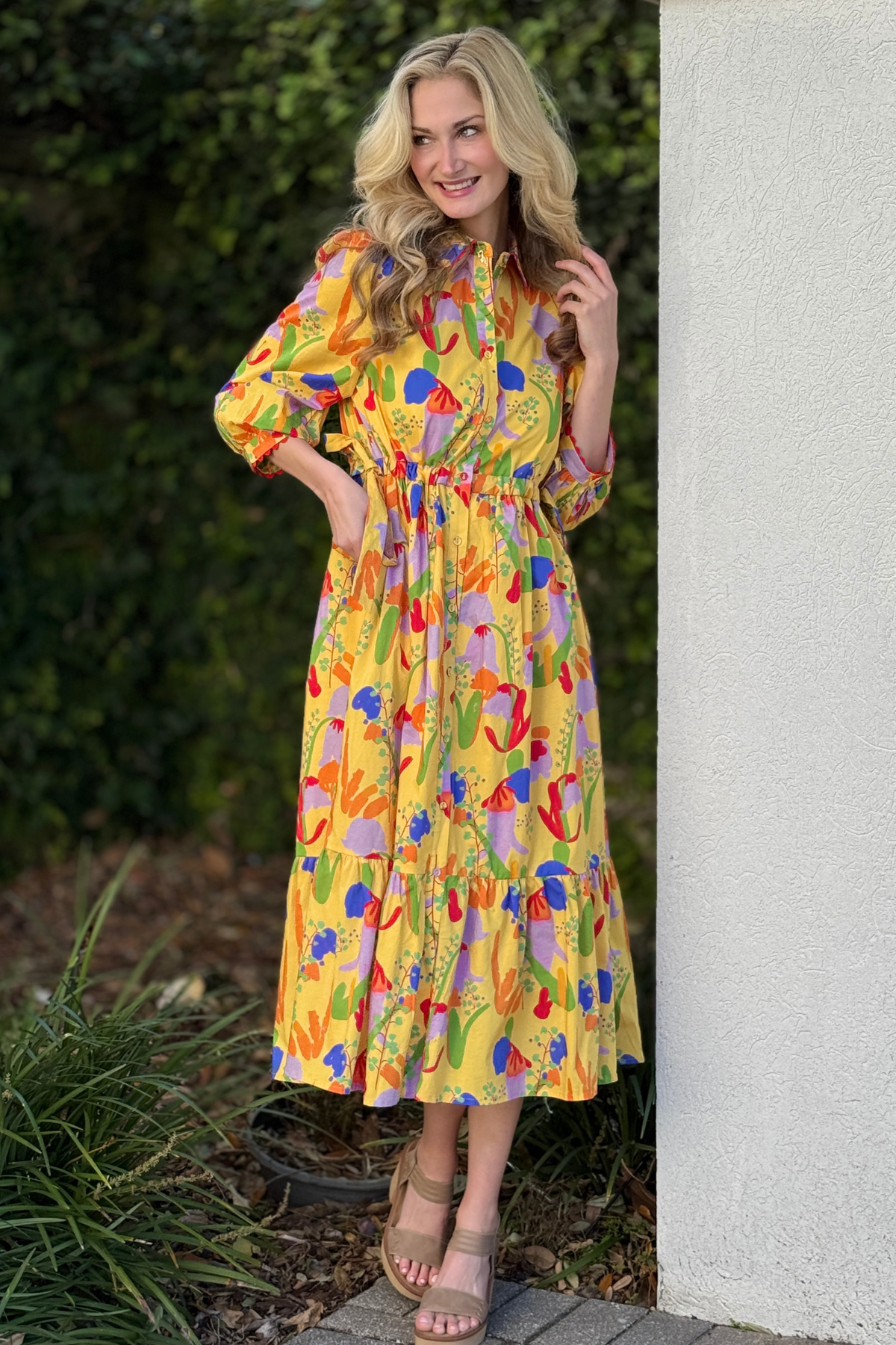 Side view of yellow floral midi dress showing drawstring waist tie detail